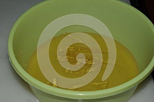 Chef is soaking gelatin sheets in cold water photo