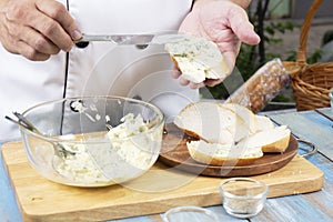 Chef spread garlic butter on slice bread