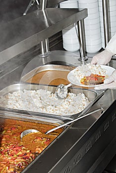 Chef standing behind full lunch service station