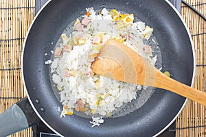 Chef stir fried rice on pan