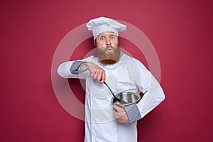 Chef is surprised about a new recipe. burgundy background