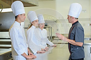 Chef talking to trainees