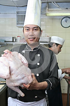 Chef with turkey poultry