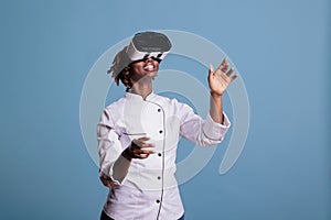 Chef in uniform playing virtual reality games