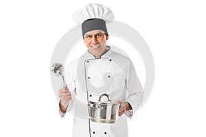 Chef in uniform and toque blanche holding pan and ladle
