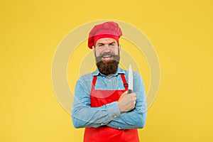 Chef using ceramic knife for cutting fruits and vegetables, professional utensils