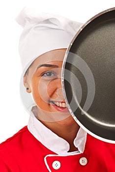 Chef woman behind frying pan