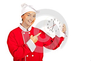 Chef woman indicate to clock