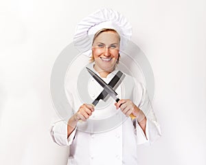 Chef woman on white background with knifes crosed.