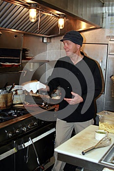 Chef at work in small kitchen