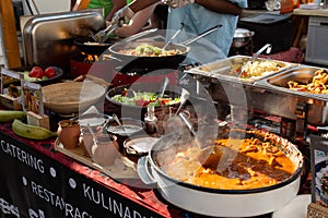 Cheff cooking fusion international cusine on street stall on international street food festival of Odprta kuhna, Open photo