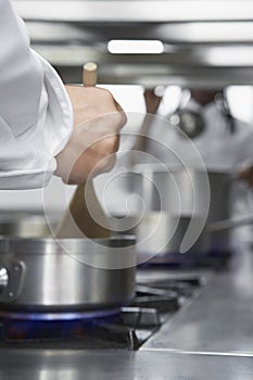 Chefs Cooking In Kitchen