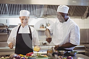 Chefs preparing food in the commercial kitchen photo