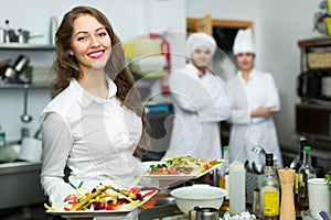 Chefs and young waiter