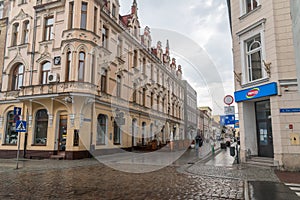 Pedestrian street in city center of Chelmno during rain