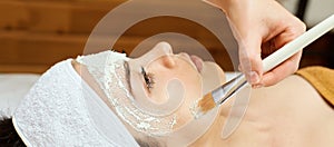 Chemic facial peel mask. Cosmetology acne treatment. Young girl at medical spa salon. Brush. Face fruit acid. Sensitive peeling