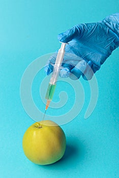 Chemical additives in food or genetically modified fruit concept