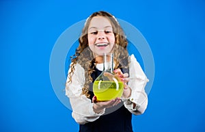 Chemical analysis. Harmful and vital options of chemical solute. Girl school pupil study chemical liquids. School