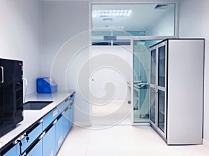 The chemical cabinet for storage chemical compounds and solvent put in laboratory room with bench lab, safety first and protect.