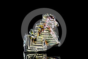 Chemical element Bismuth in front of black background