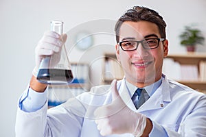 The chemical engineer working on oil samples in lab