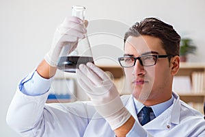 The chemical engineer working on oil samples in lab