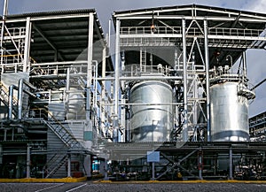 Chemical factory. Elastomer and thermoplastic production line. Large vats for preparing monomers and polymerization