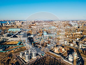 Chemical factory industrial area. Aerial view. Large vats connected by pipeline