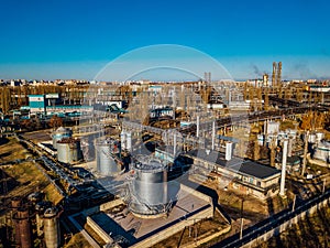 Chemical factory industrial area. Aerial view. Large vats connected by pipeline