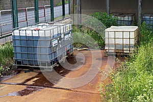 Chemical factory plastic container leaking pollution, leak rusty spill