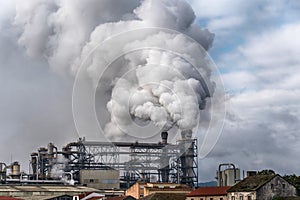 Chemical factory with smoke stack. Smoke emission from factory pipes. Ecology and environmental protection problems, air pollution