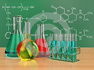 Chemical flasks and blackboard with formulas.