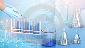 Chemical fluids to test the tubes and hand of scientist .laboratory research development concept. sample chemistry