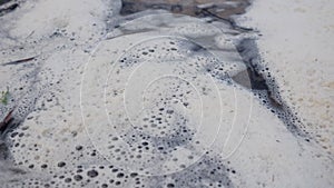 Chemical foam on water background ecology problem concept