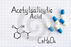Chemical formula of Acetylsalicylic Acid with some pills. photo