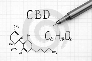 Chemical formula of Cannabidiol CBD with black pen