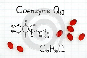 Chemical formula of Coenzyme Q10 with red pills. photo