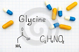 Chemical formula of glycine with some pills.