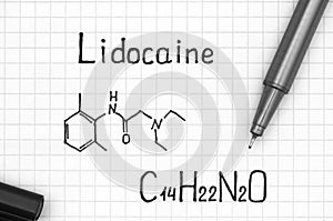 Chemical formula of Lidocaine with black pen photo