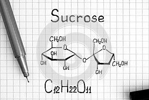 Chemical formula of Sucrose with black pen photo