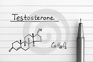 Chemical formula of Testosterone with black pen on lined paper.