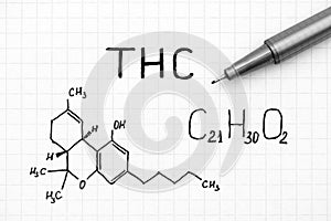 Chemical formula of THC with black pen.