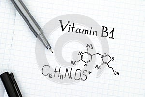 Chemical formula of Vitamin B1 with black pen