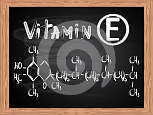 Chemical formula of vitamin E written on blackboard