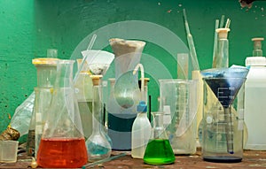 Chemical lab, you can see beakers and flasks on the table