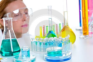 Chemical laboratory scientist woman with test tubes