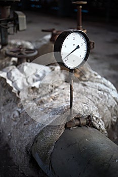 Chemical plant equipment. Old pressure control sensor pressure gauge on the pipeline