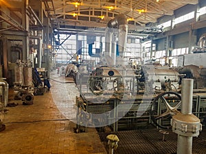 Chemical plant inside. Pneumatic flow control valve for industrial refinery or chemical plant. Equipment, cables and pipelines