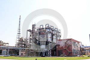 Chemical plant for the processing of petroleum products with rectification columns, reactors, heat exchangers, pipes, pumps at an