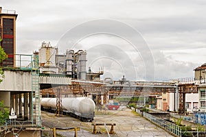 At a chemical plant there are railway tanks with chemicals.